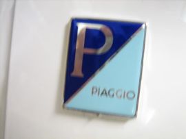 Badge front cowl connected 46x37mm "PIAGGIO" Vespa PX My, 2011